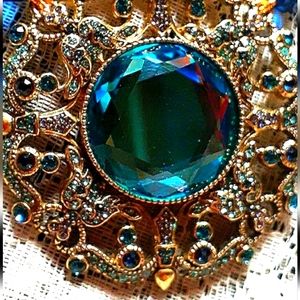 Heidi Daus medallion necklace.